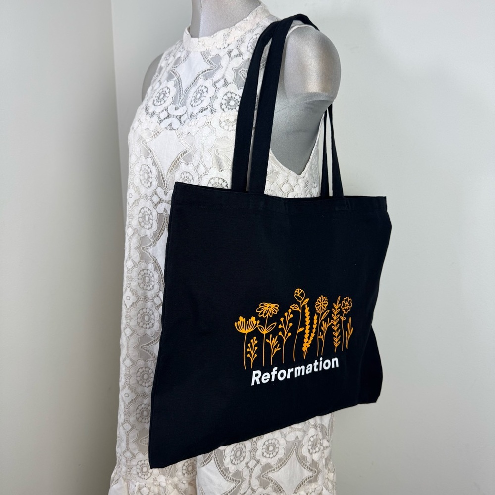 REFORMATION Canvas Tote Bag in Black With White Graphic Print & Wild Flowers